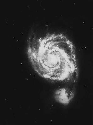 Спиральная галактика в созвездии Гончих Псов, соединённая со своим спутником.